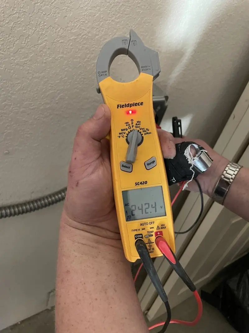 Voltage testing with clamp meter during Ceiling Fan Installation in West Monroe